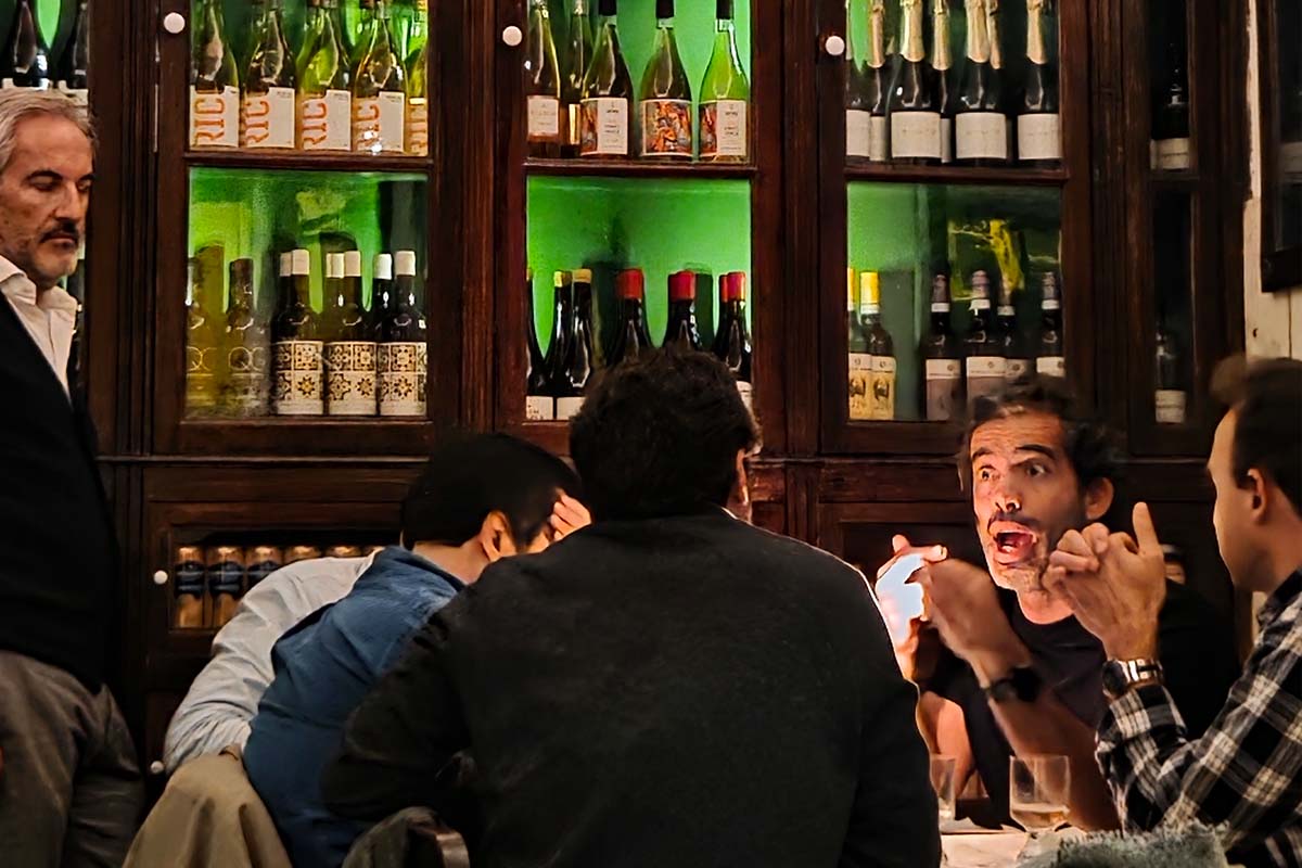 O Palmeiral restaurant set for private dining — long table with white tablecloths and candlelight in the 1870s interior, Príncipe Real, Lisbon