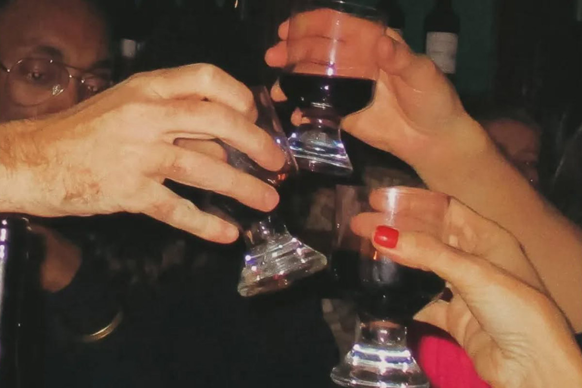 Private dining table set for a group event at O Palmeiral, Príncipe Real, Lisbon — candlelit, white tablecloths, original 1870s interior